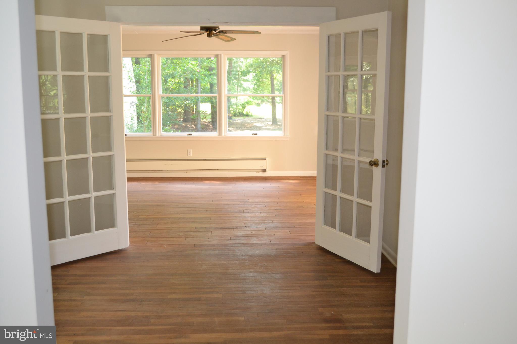 7598 Blueberry Acres Road St. Michaels, MD 21663 - Photo 10 of 30 French doors from dining area to sun room