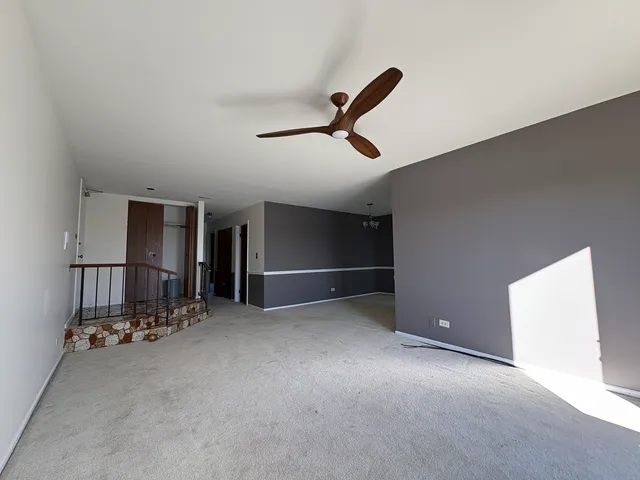 an empty room with closet and wooden floor