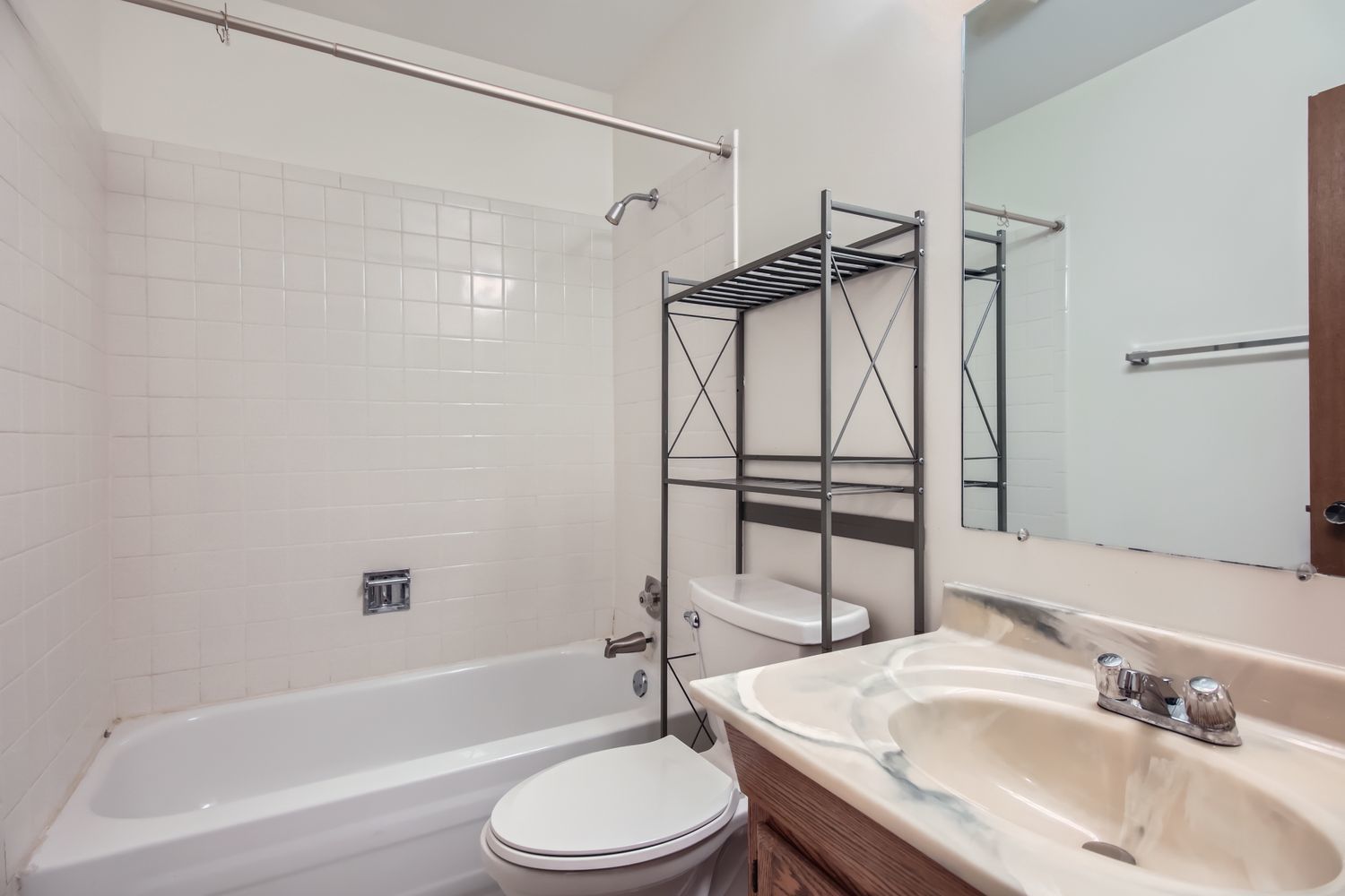 372 Springlake Lane, Unit C Aurora, IL 60504 - Photo 9 of 10 a bathroom with a sink toilet and shower