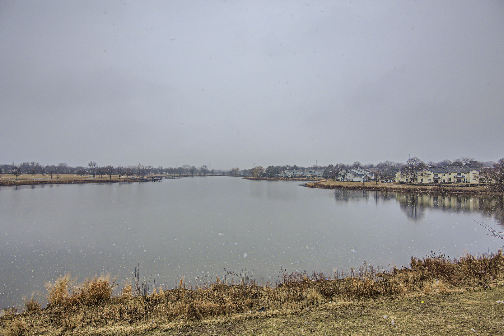 372 Springlake Lane, Unit C Aurora, IL 60504 - Photo 10 of 10 a view of a lake with a beach
