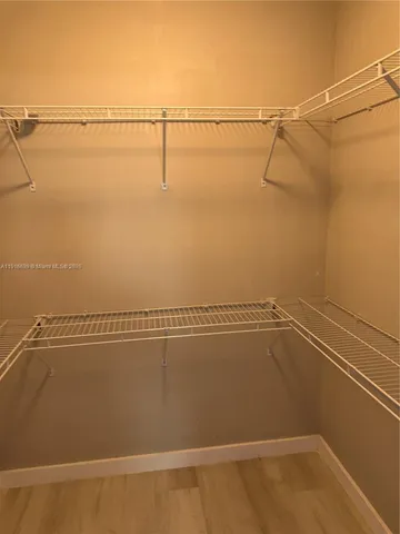 a view of a room with racks on the wall