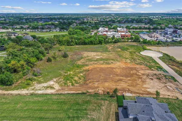 a view of a town with mountains in the background