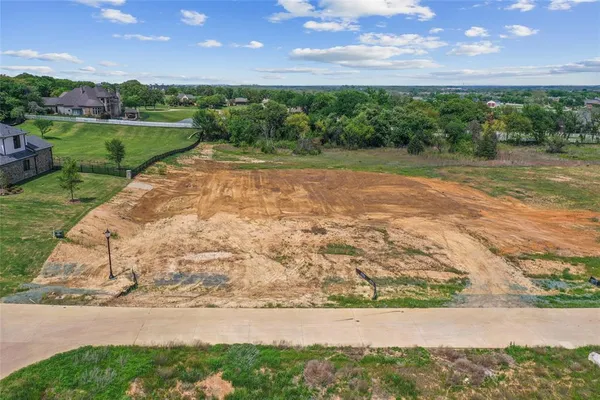 a view of a street with a yard
