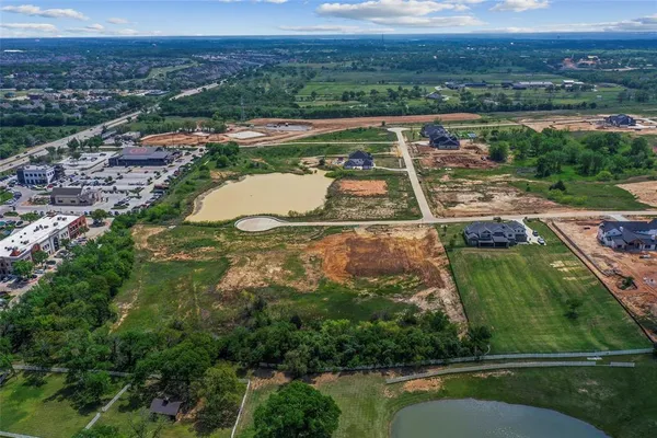 an aerial view of a house with a lake view