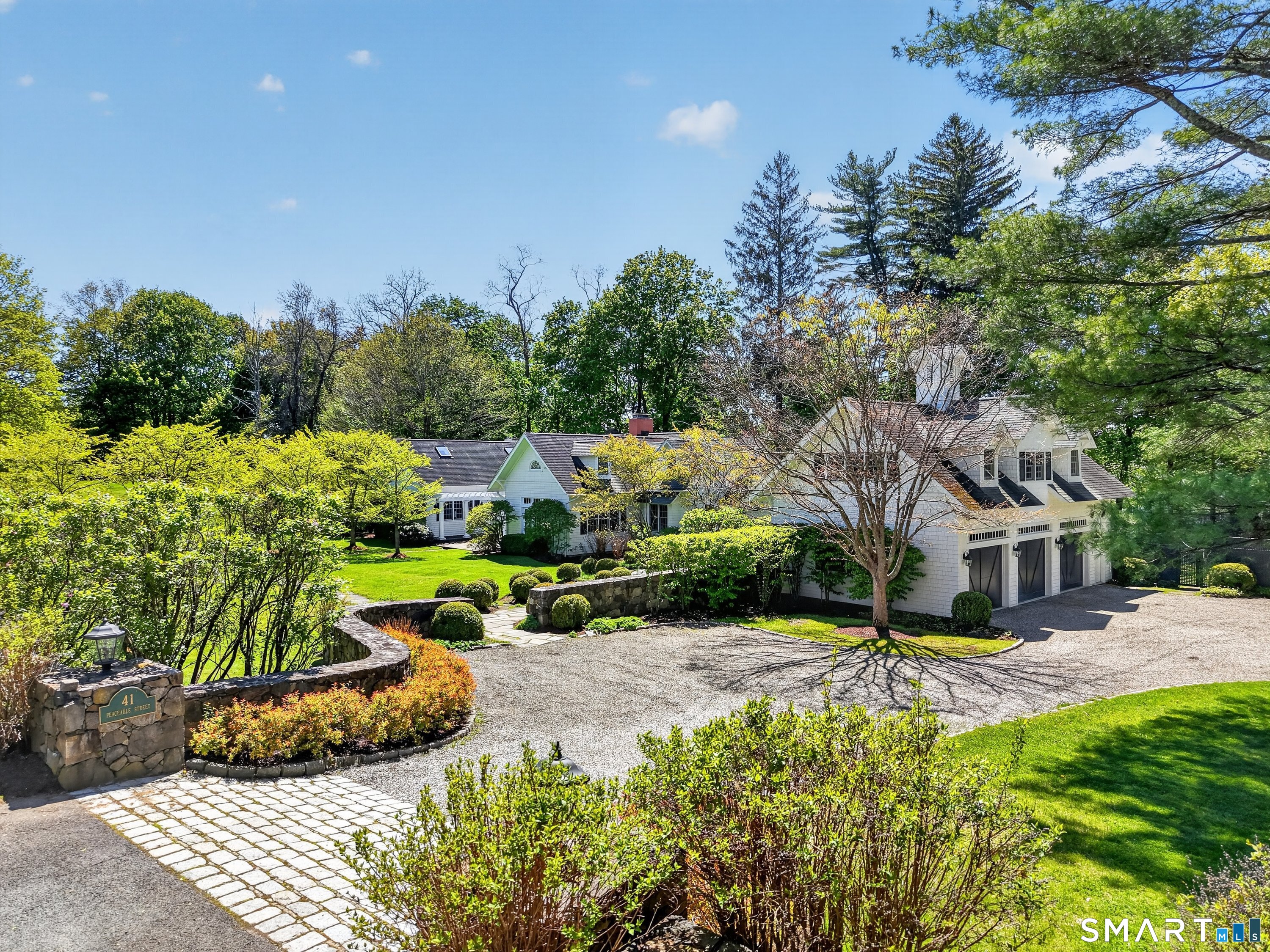 41 Peaceable Street Ridgefield, CT 06877 - Photo 1 of 40 a view of a backyard with sitting area