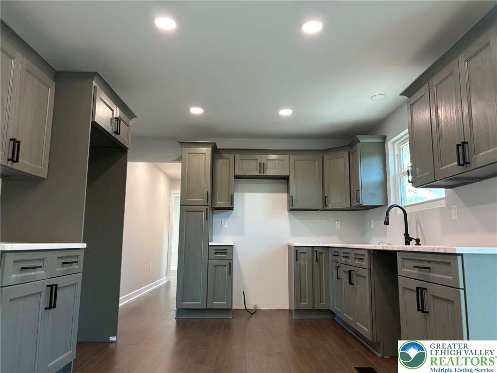 3957 Mountain Road Slatington, PA 18080 - Photo 10 of 33 a kitchen with kitchen island a sink stainless steel appliances and cabinets