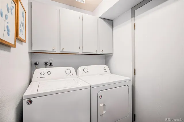 a view of storage and utility room with washer and dryer