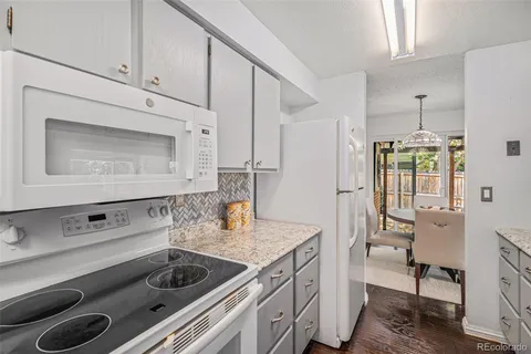 a kitchen with a sink appliances and cabinets