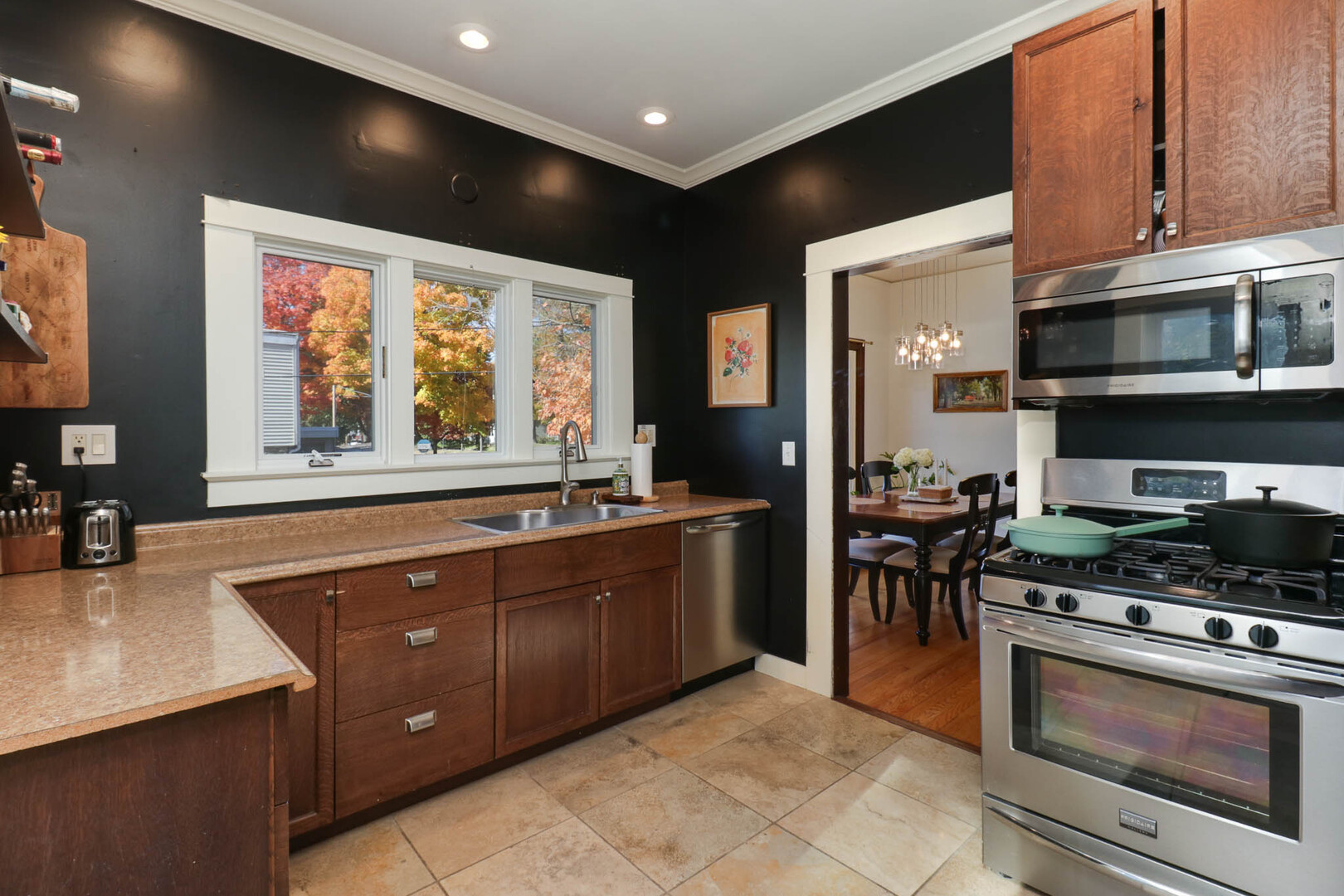 601 East Grove Street Bloomington, IL 61701 - Photo 12 of 42 a kitchen with stainless steel appliances granite countertop a stove and a sink