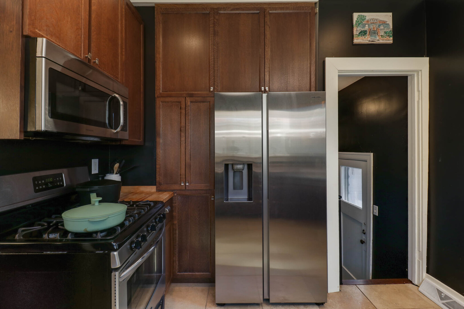 601 East Grove Street Bloomington, IL 61701 - Photo 13 of 42 a kitchen with a refrigerator stove and microwave