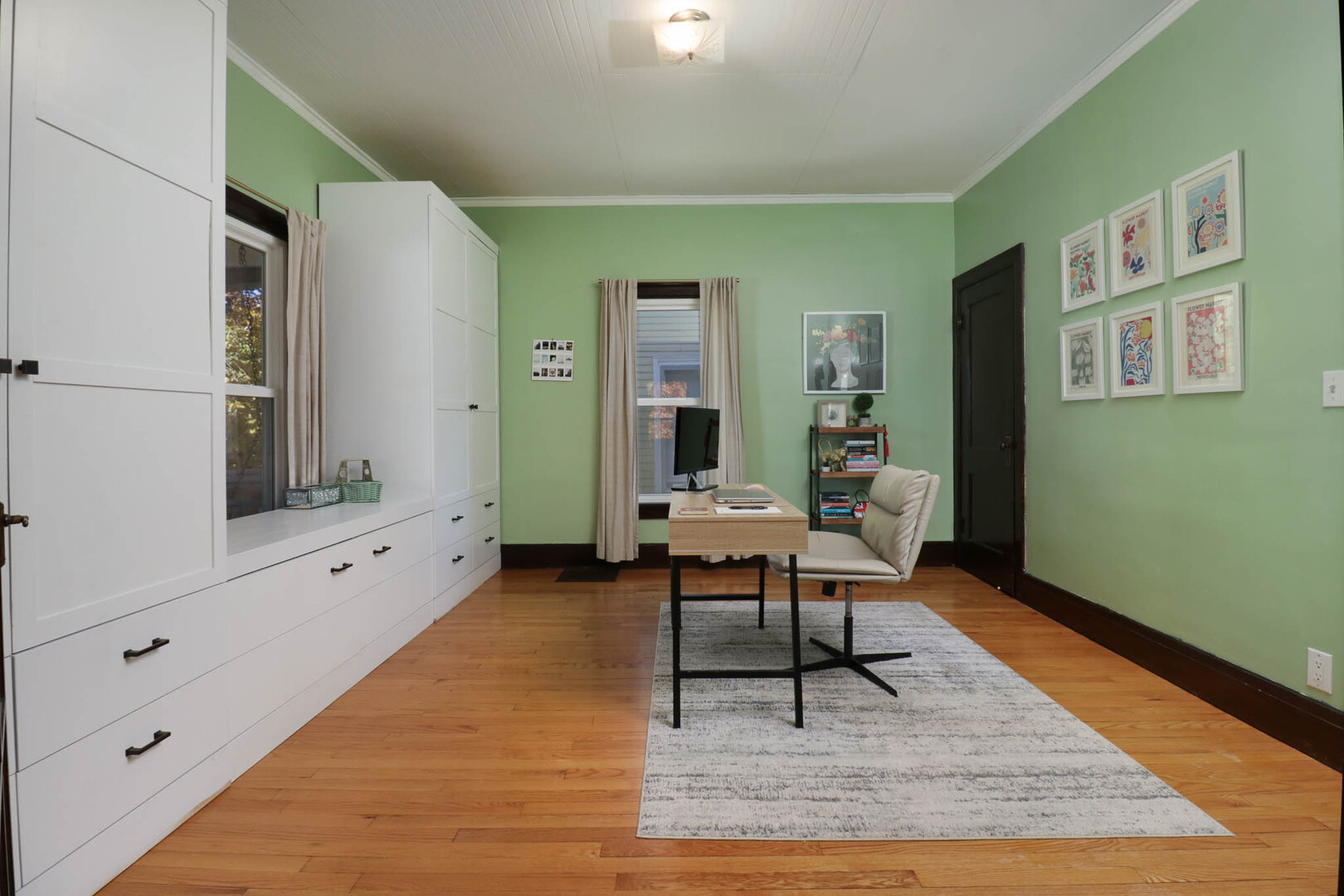 601 East Grove Street Bloomington, IL 61701 - Photo 14 of 42 a living room with furniture and a wooden floor