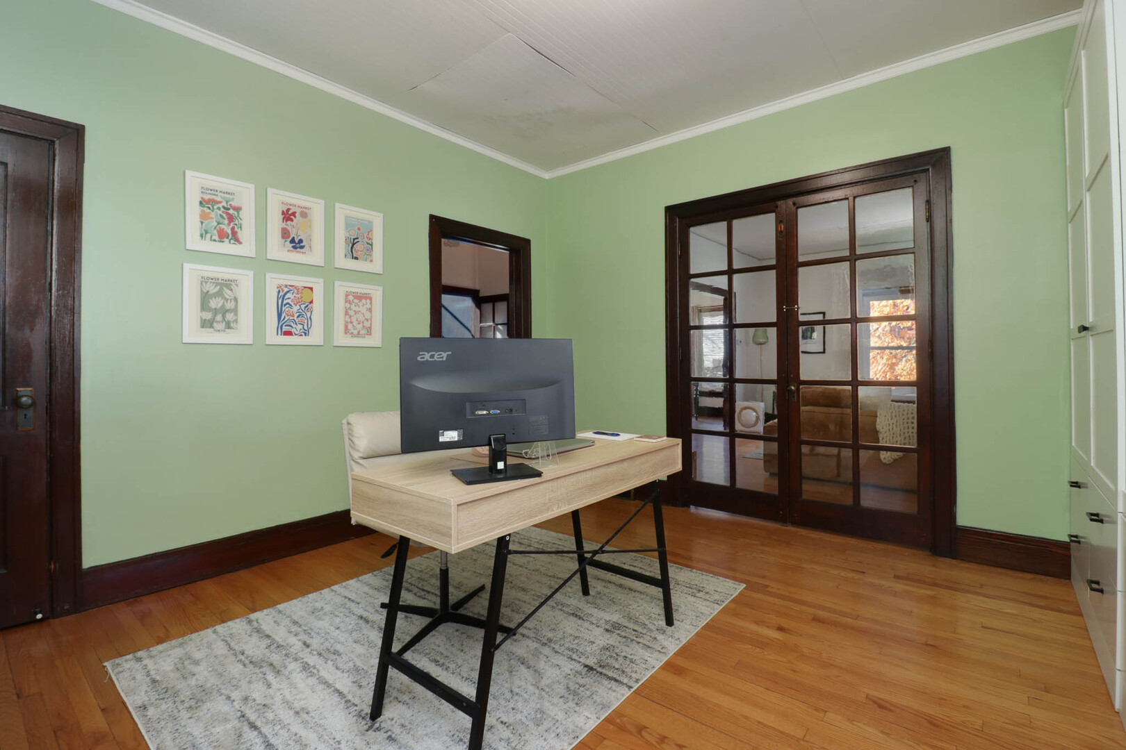 601 East Grove Street Bloomington, IL 61701 - Photo 15 of 42 a workspace with furniture window and wooden floor