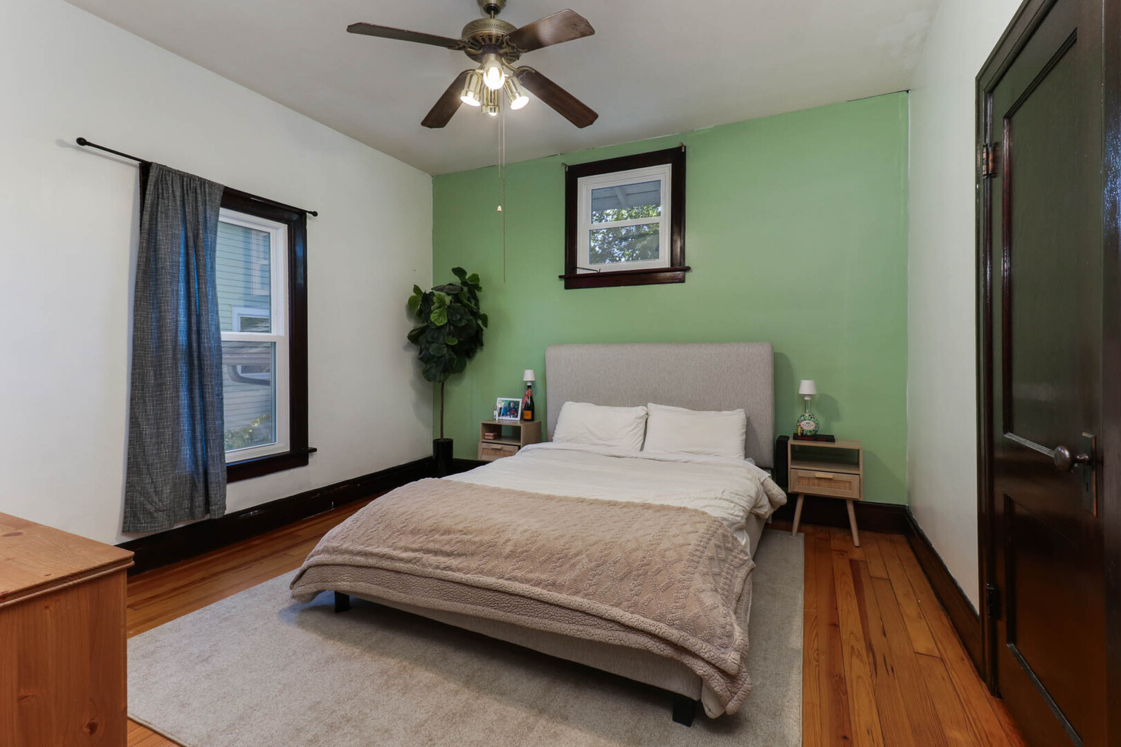 601 East Grove Street Bloomington, IL 61701 - Photo 17 of 42 a bedroom with a bed and a chandelier