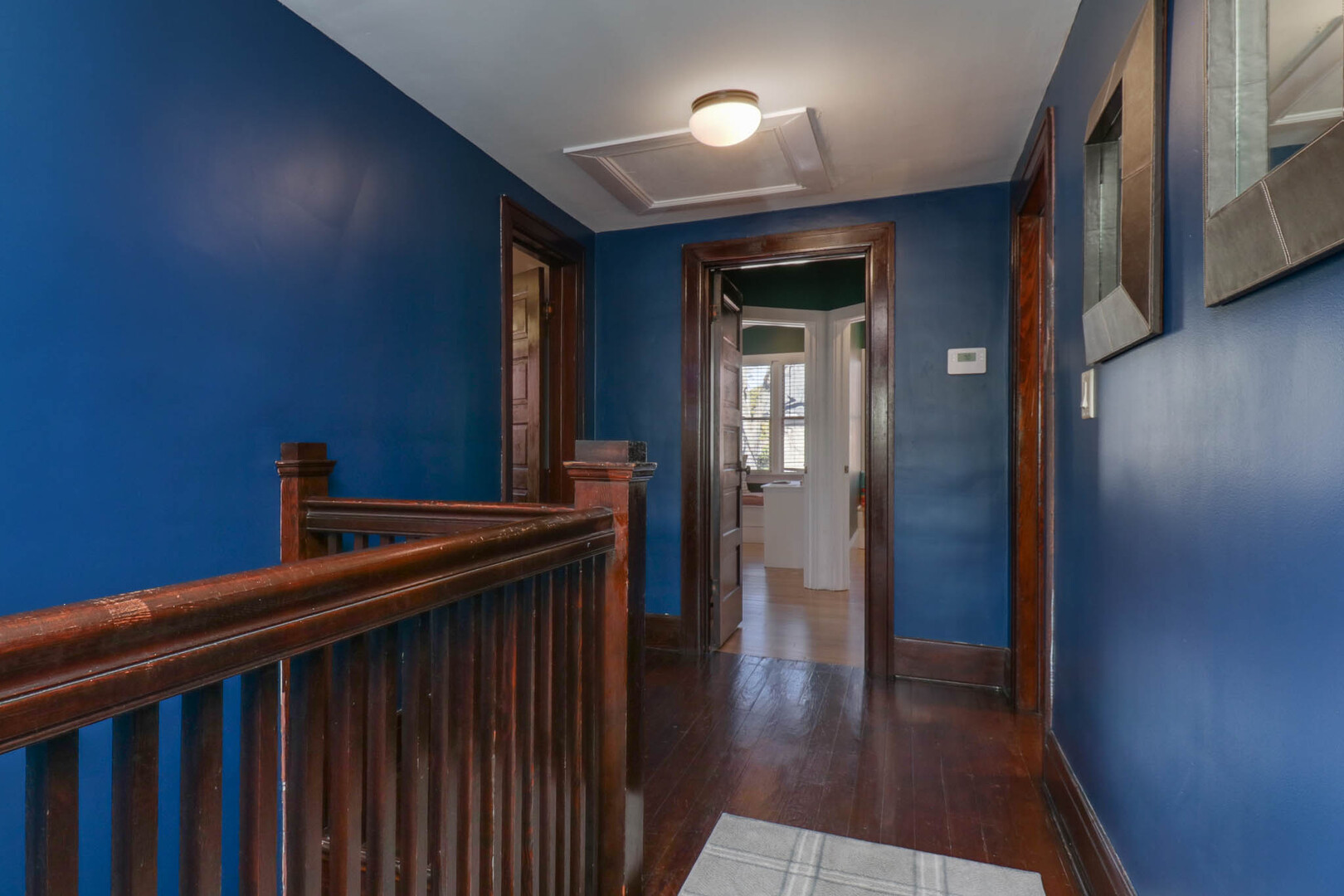 601 East Grove Street Bloomington, IL 61701 - Photo 21 of 42 a hallway with wooden floor windows and a kitchen