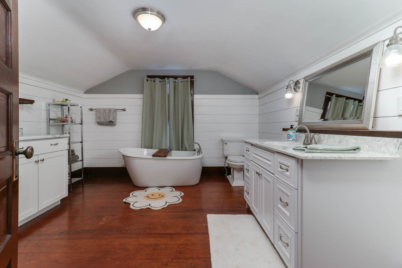 601 East Grove Street Bloomington, IL 61701 - Photo 22 of 42 a bathroom with a granite countertop sink mirror and toilet