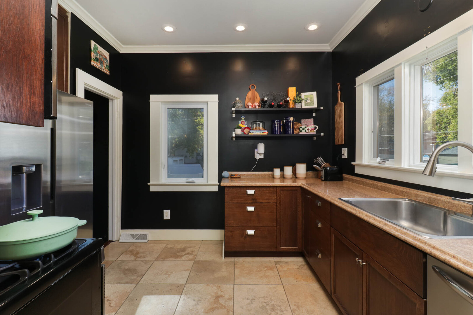601 East Grove Street Bloomington, IL 61701 - Photo 3 of 42 a kitchen with stainless steel appliances granite countertop a sink and a stove