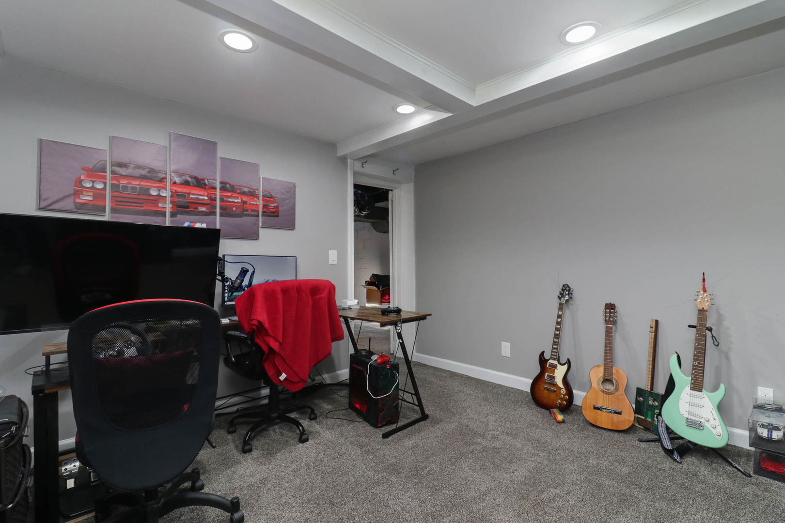 601 East Grove Street Bloomington, IL 61701 - Photo 35 of 42 a bedroom with furniture and a flat screen tv