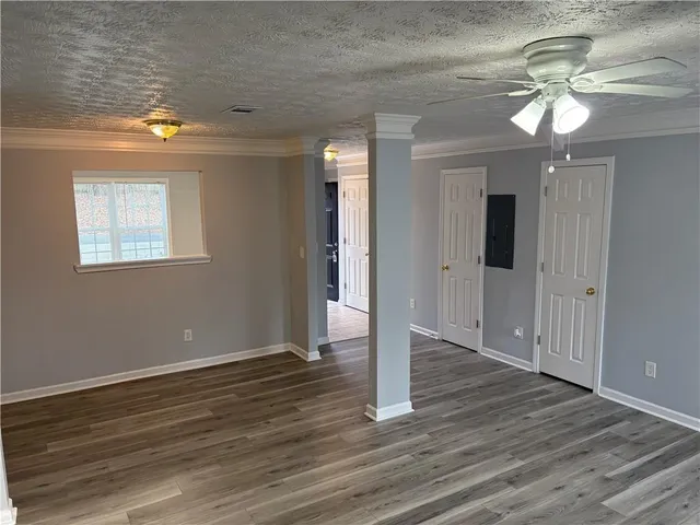 a view of a livingroom with wooden floor