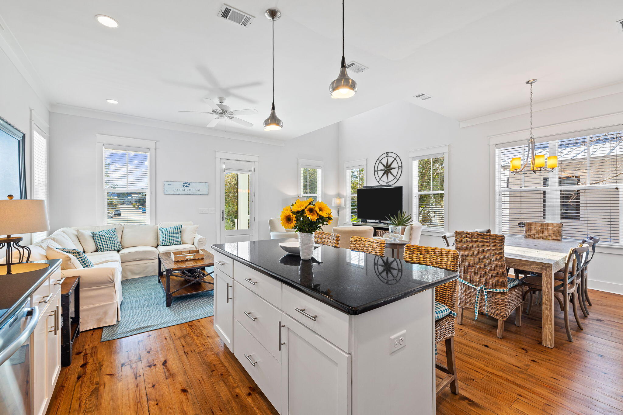 27 Matt's Way Santa Rosa Beach, FL 32459 - Photo 29 of 67 a kitchen with a sink dishwasher a dining table and chairs with wooden floor