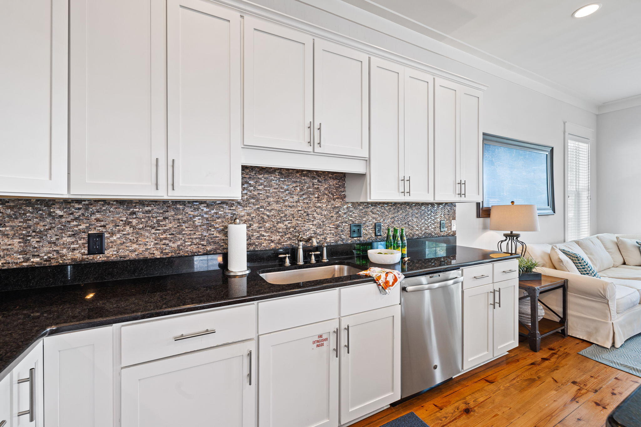 27 Matt's Way Santa Rosa Beach, FL 32459 - Photo 30 of 67 a kitchen with white cabinets sink and white appliances