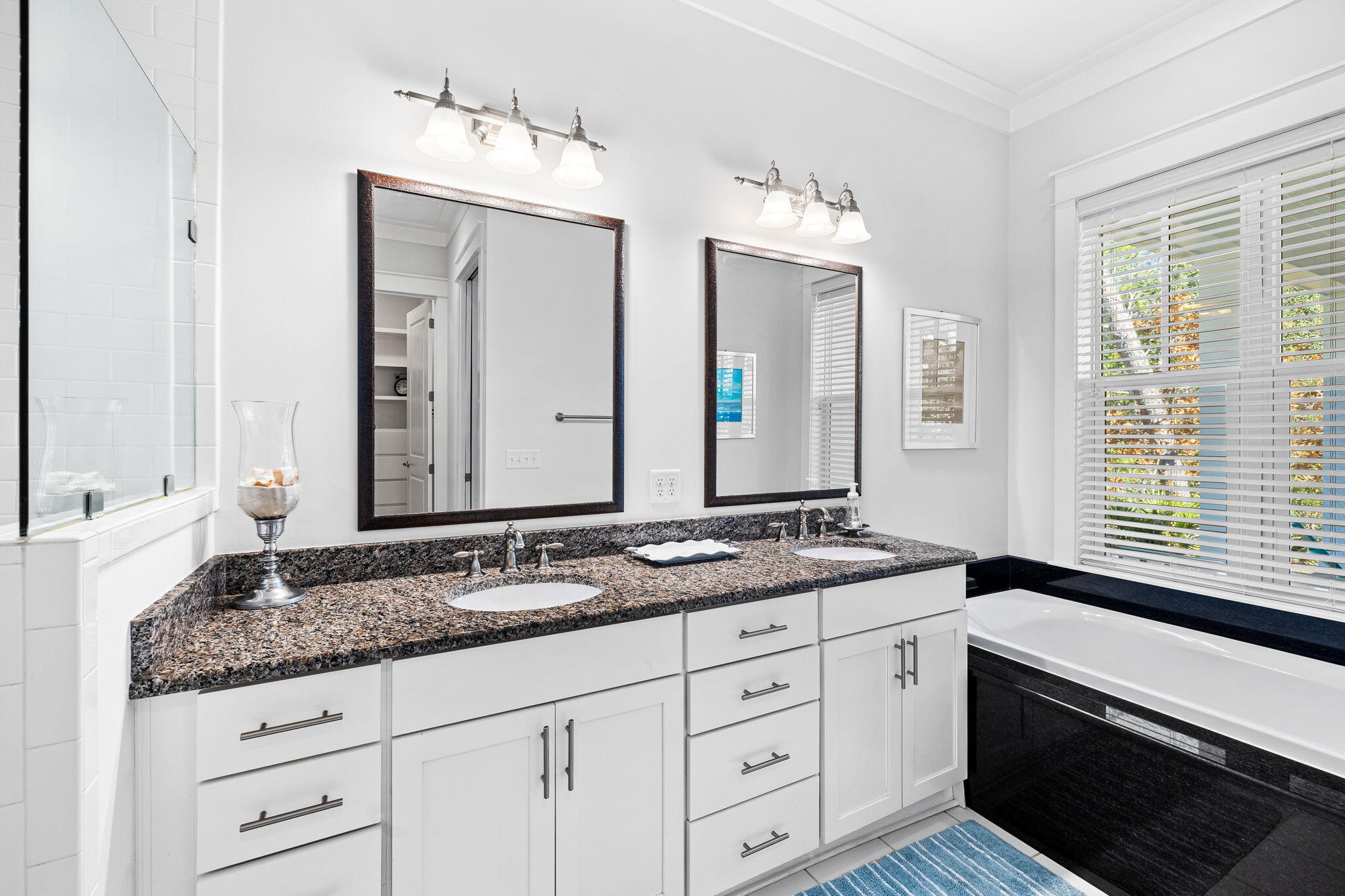 27 Matt's Way Santa Rosa Beach, FL 32459 - Photo 39 of 67 a bathroom with a granite countertop double vanity sink a mirror and a