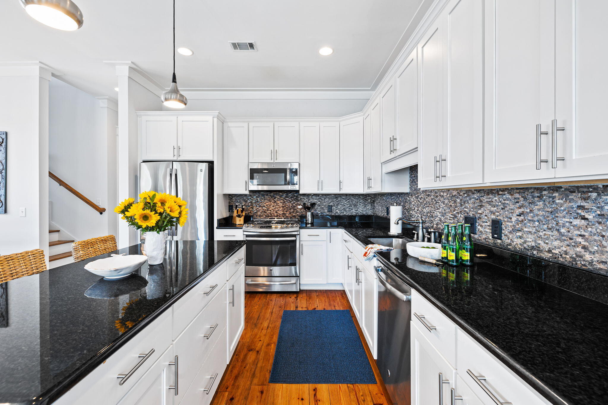 27 Matt's Way Santa Rosa Beach, FL 32459 - Photo 7 of 67 a kitchen with kitchen island granite countertop a sink a counter space appliances and cabinets