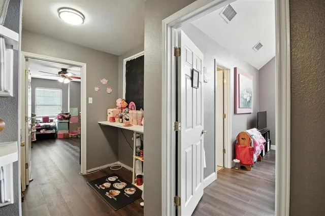 a bedroom with bed and a hallway