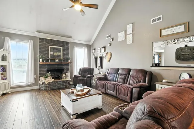 a living room with furniture and a fireplace