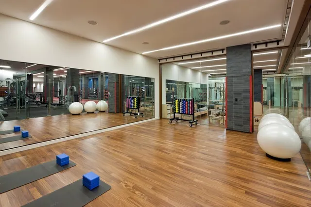 a room with lots of gym equipment