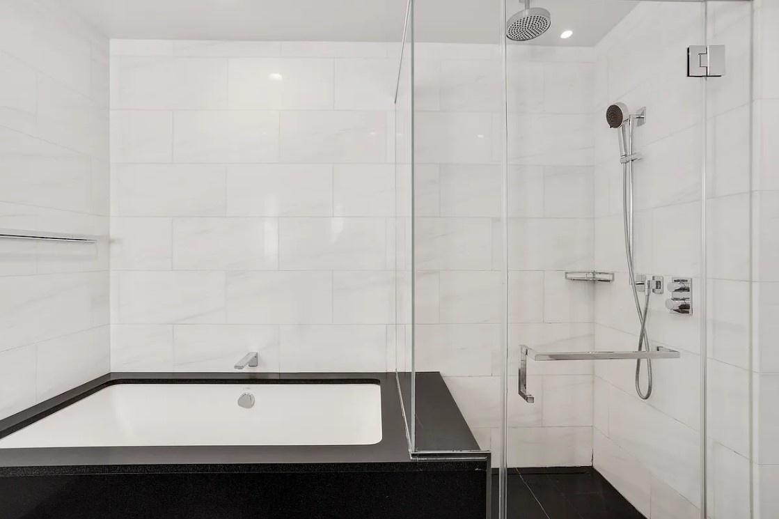 50 Riverside Boulevard, Unit 5B Manhattan, NY 10069 - Photo 6 of 26 a bathroom with a sink and shower