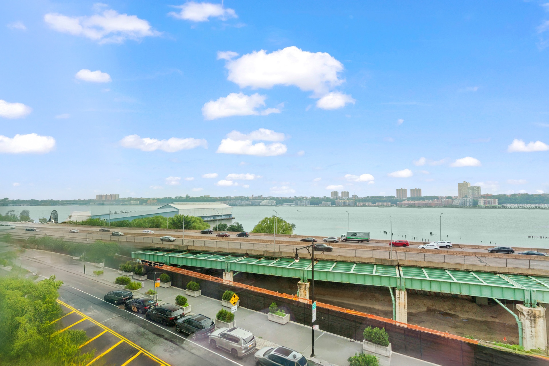 50 Riverside Boulevard, Unit 5B Manhattan, NY 10069 - Photo 9 of 26 a view of a lake with a big yard