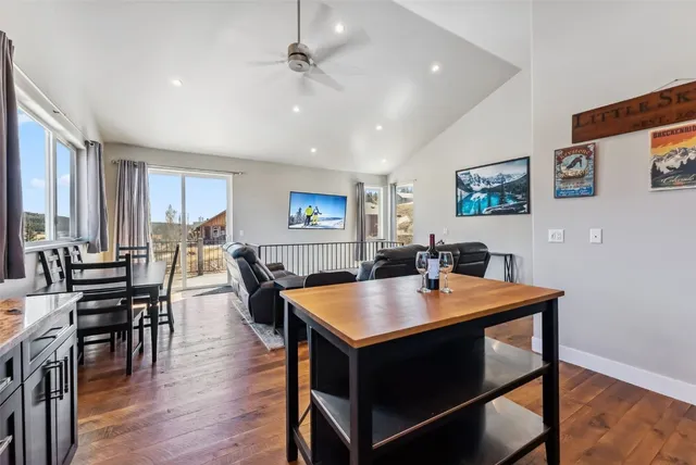 a kitchen with granite countertop sink and cabinets