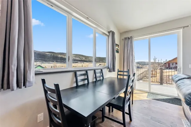 a white toilet sitting next to a shower