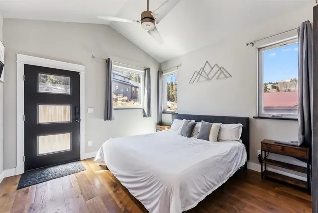 a bedroom with a bed and a night stand