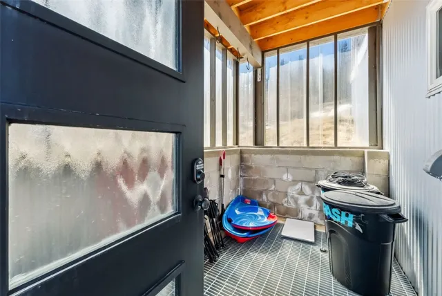 a bathroom with a tub and a window