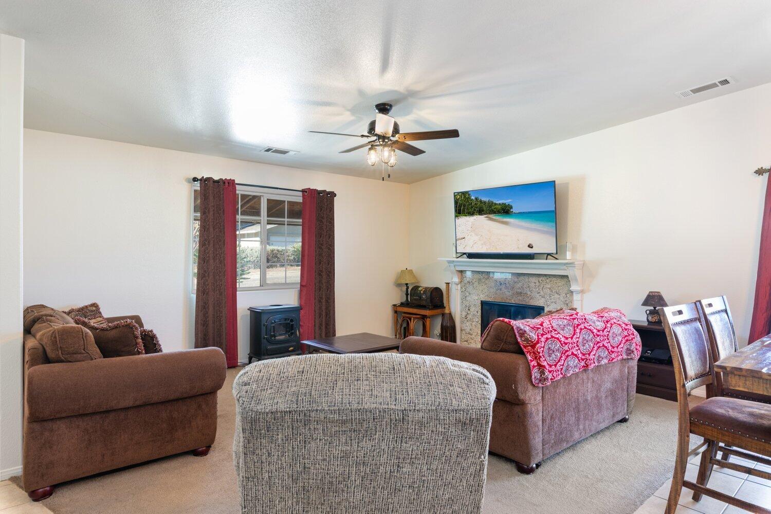 14290 Rafael Street Cabazon, CA 92230 - Photo 11 of 41 a bedroom with furniture and a ceiling fan