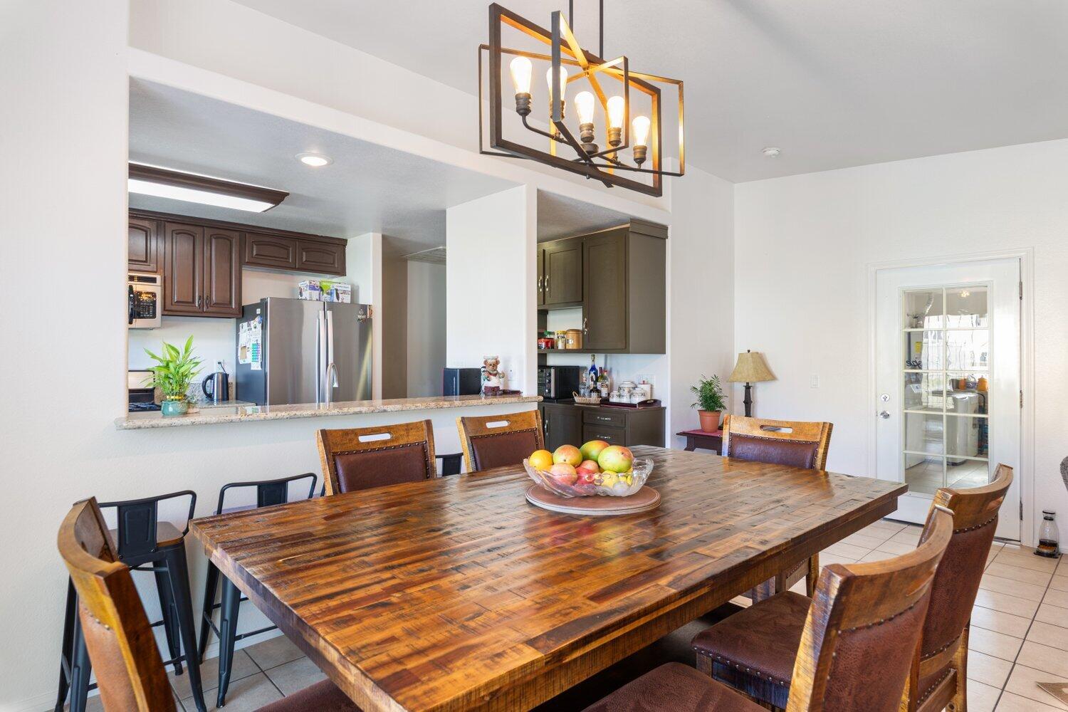 14290 Rafael Street Cabazon, CA 92230 - Photo 15 of 41 a view of a dining room and a table with chairs