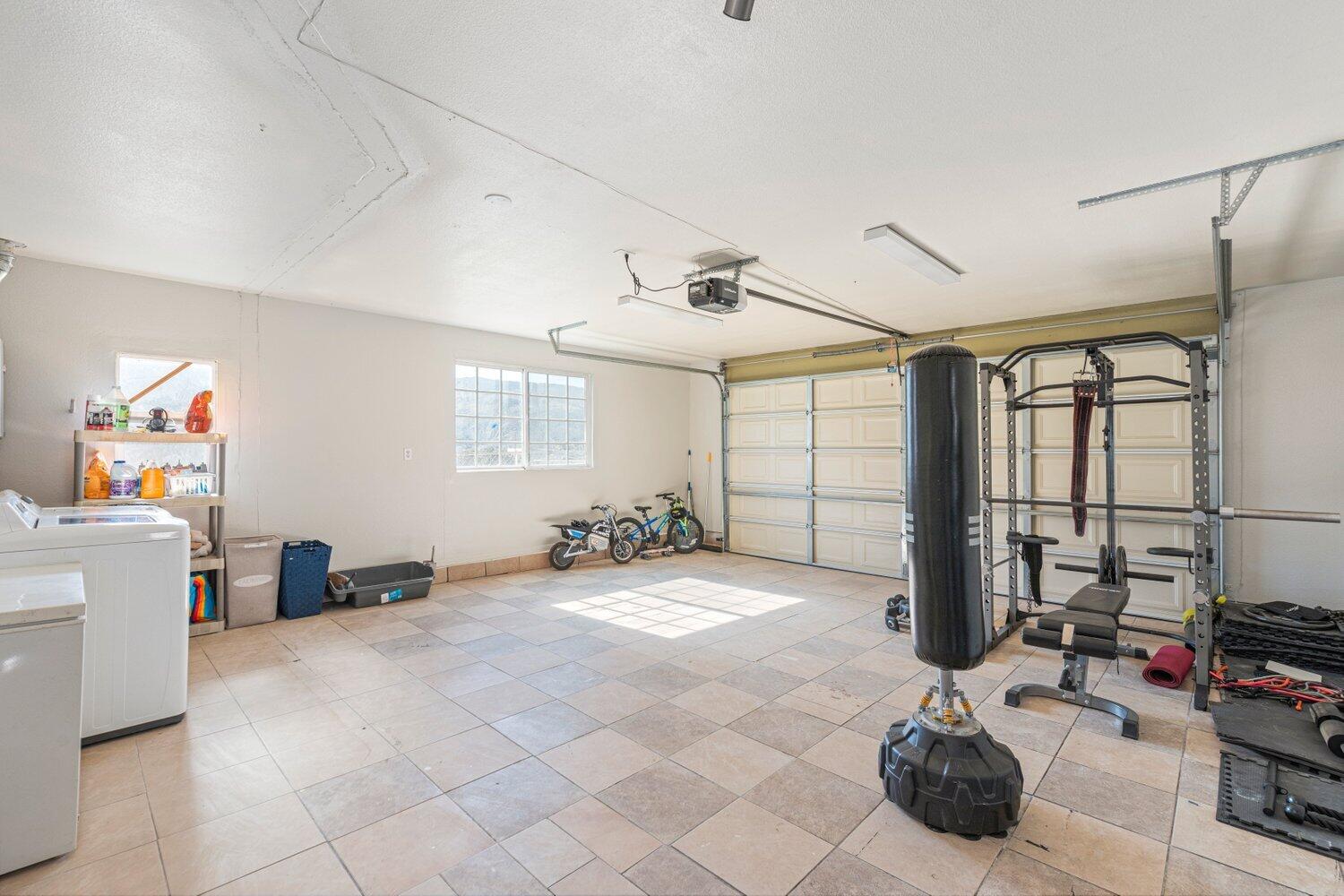 14290 Rafael Street Cabazon, CA 92230 - Photo 23 of 41 a large bedroom with a bed and large windows