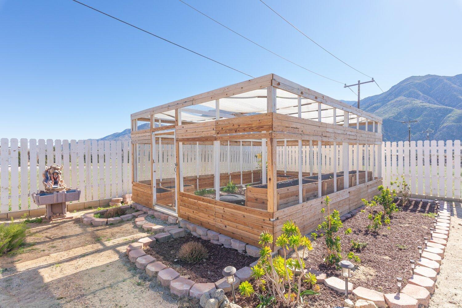 14290 Rafael Street Cabazon, CA 92230 - Photo 30 of 41 a view of a porch with a table and chairs