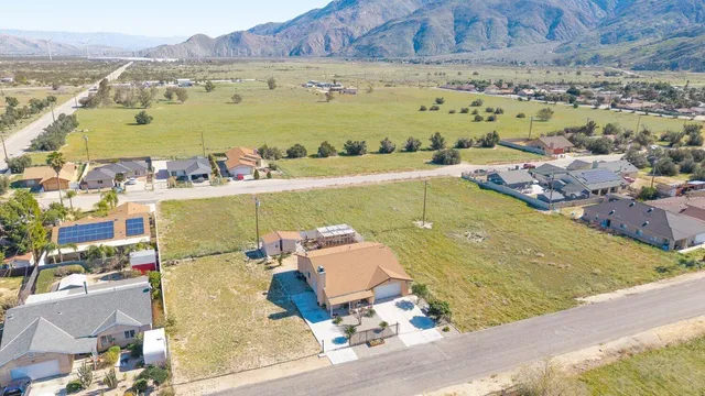 an aerial view of a house with a ocean view