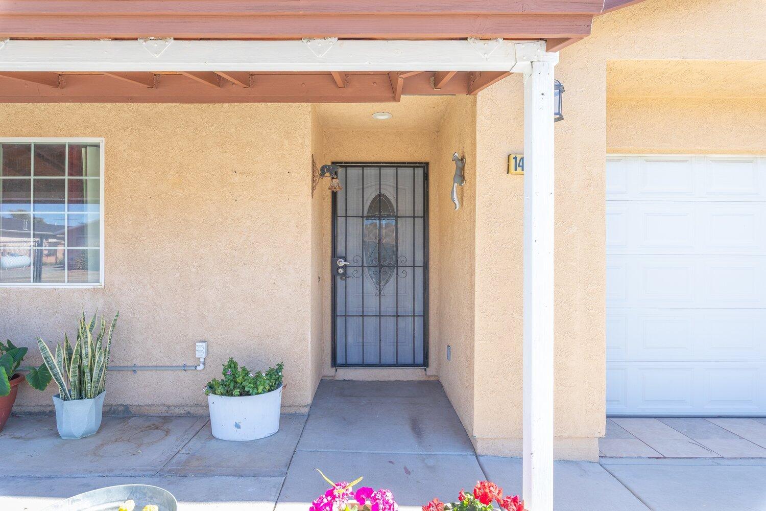 14290 Rafael Street Cabazon, CA 92230 - Photo 9 of 41 a view of a entryway door of the house
