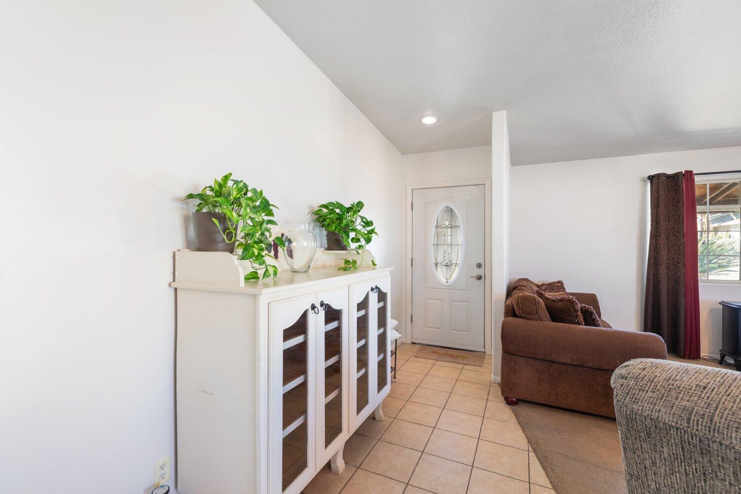 14290 Rafael Street Cabazon, CA 92230 - Photo 10 of 41 a living room with furniture and a potted plant