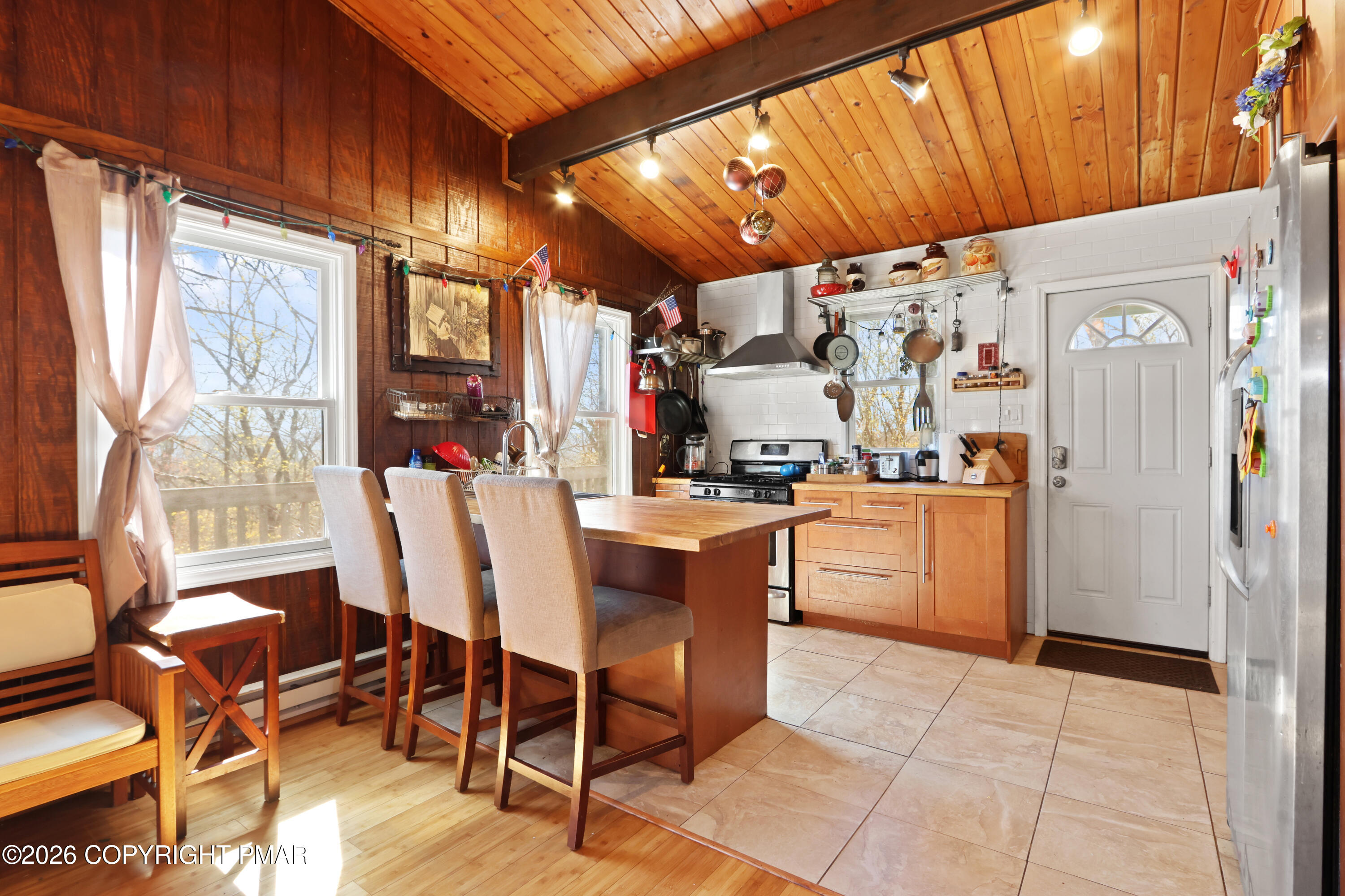 214 Mockingbird Trail Bushkill, PA 18324 - Photo 11 of 41 a view of a dining room with furniture window and outside view