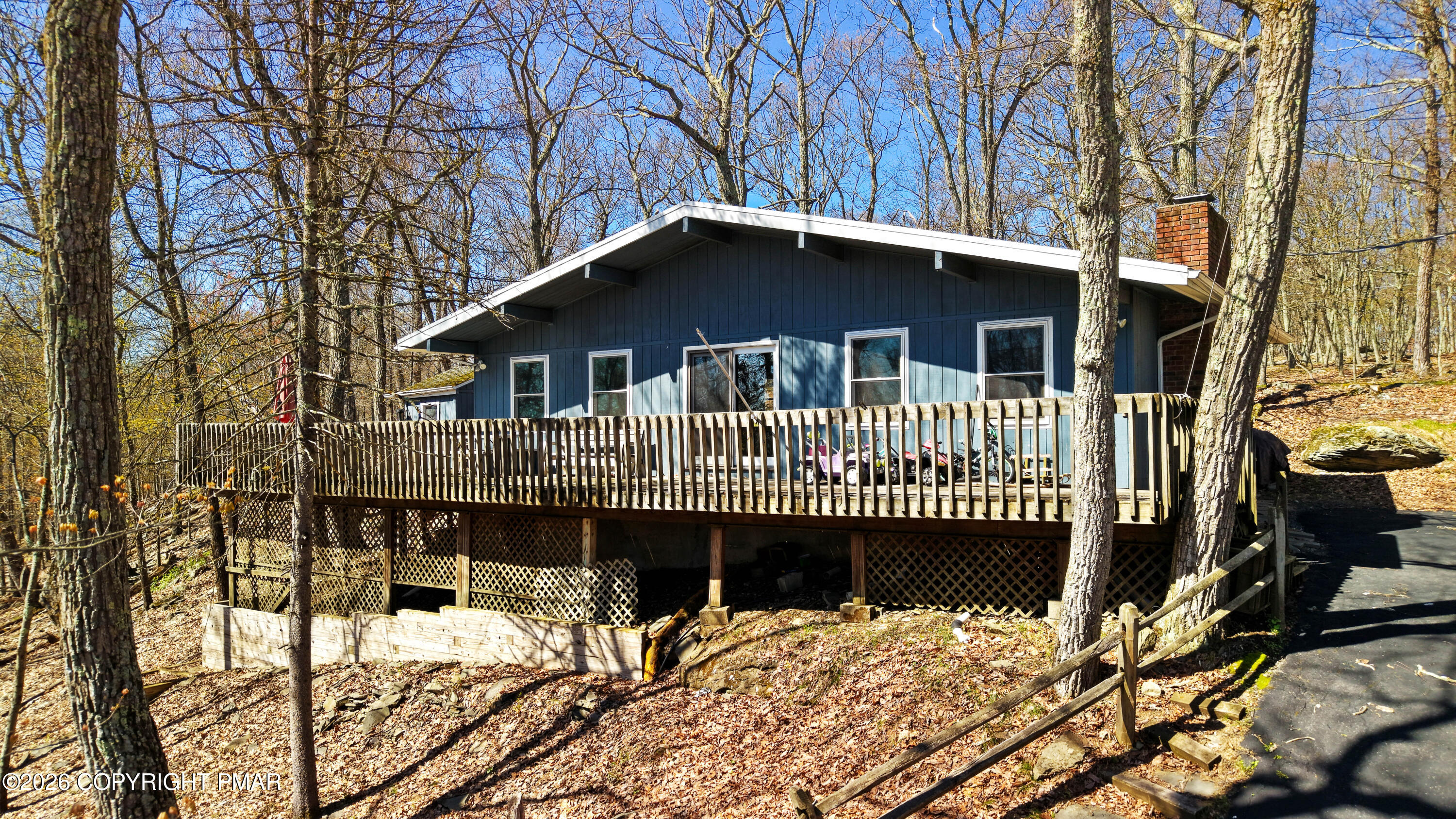 214 Mockingbird Trail Bushkill, PA 18324 - Photo 2 of 41 a front view of a house with a yard covered with snow in balcony