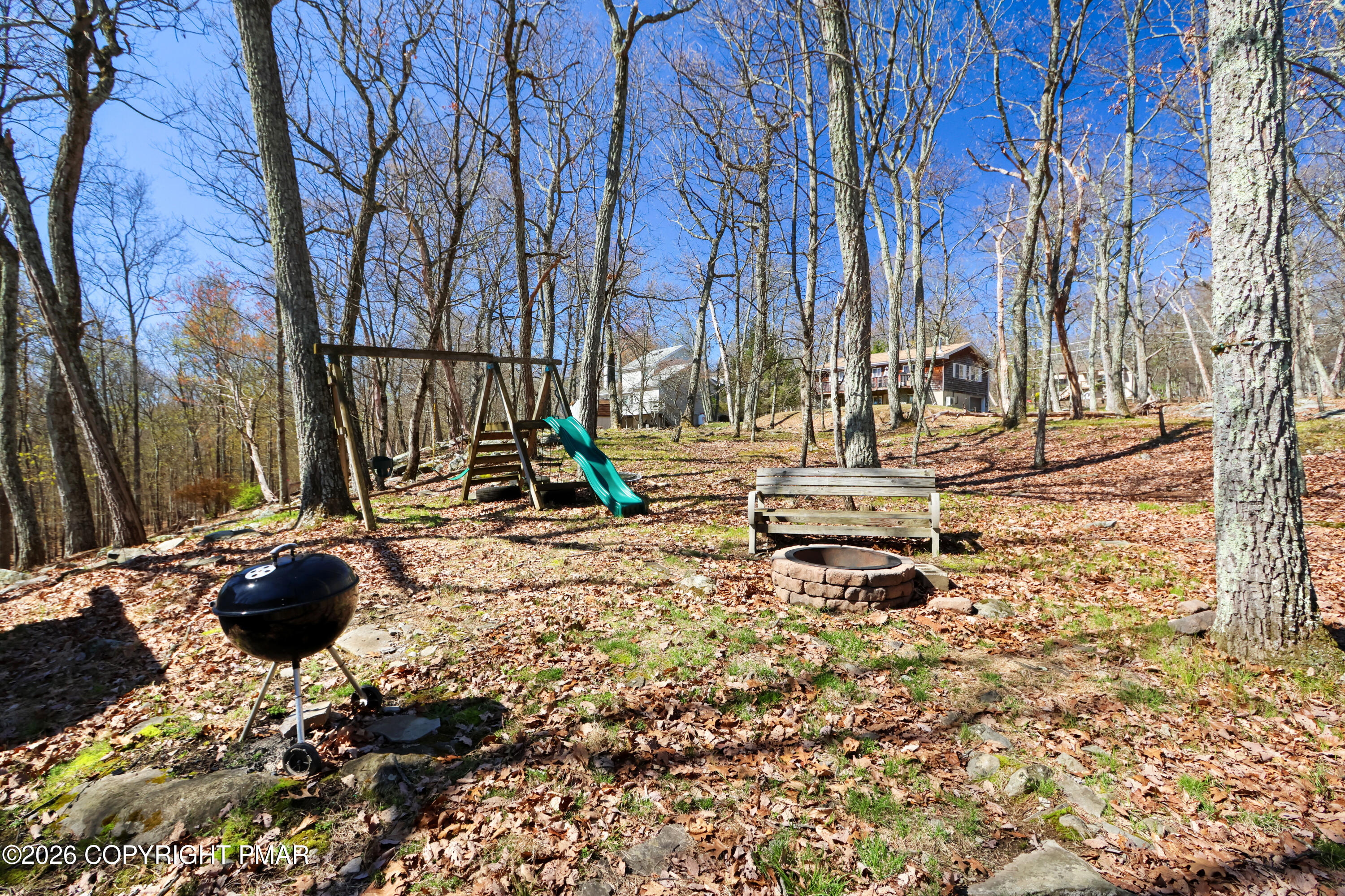 214 Mockingbird Trail Bushkill, PA 18324 - Photo 25 of 41 a backyard of a house with lots of green space