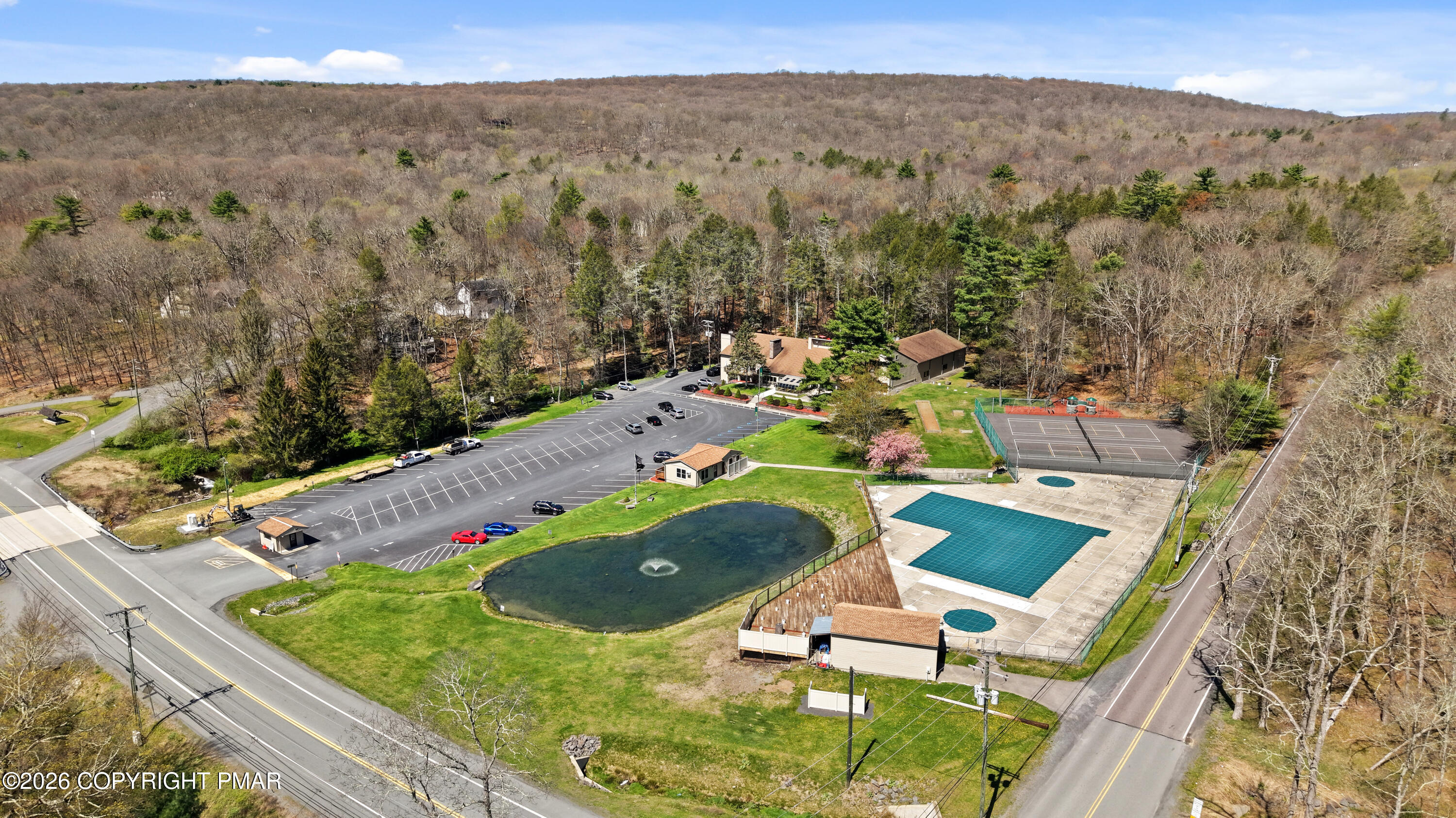 214 Mockingbird Trail Bushkill, PA 18324 - Photo 30 of 41 a view of a pool with a yard
