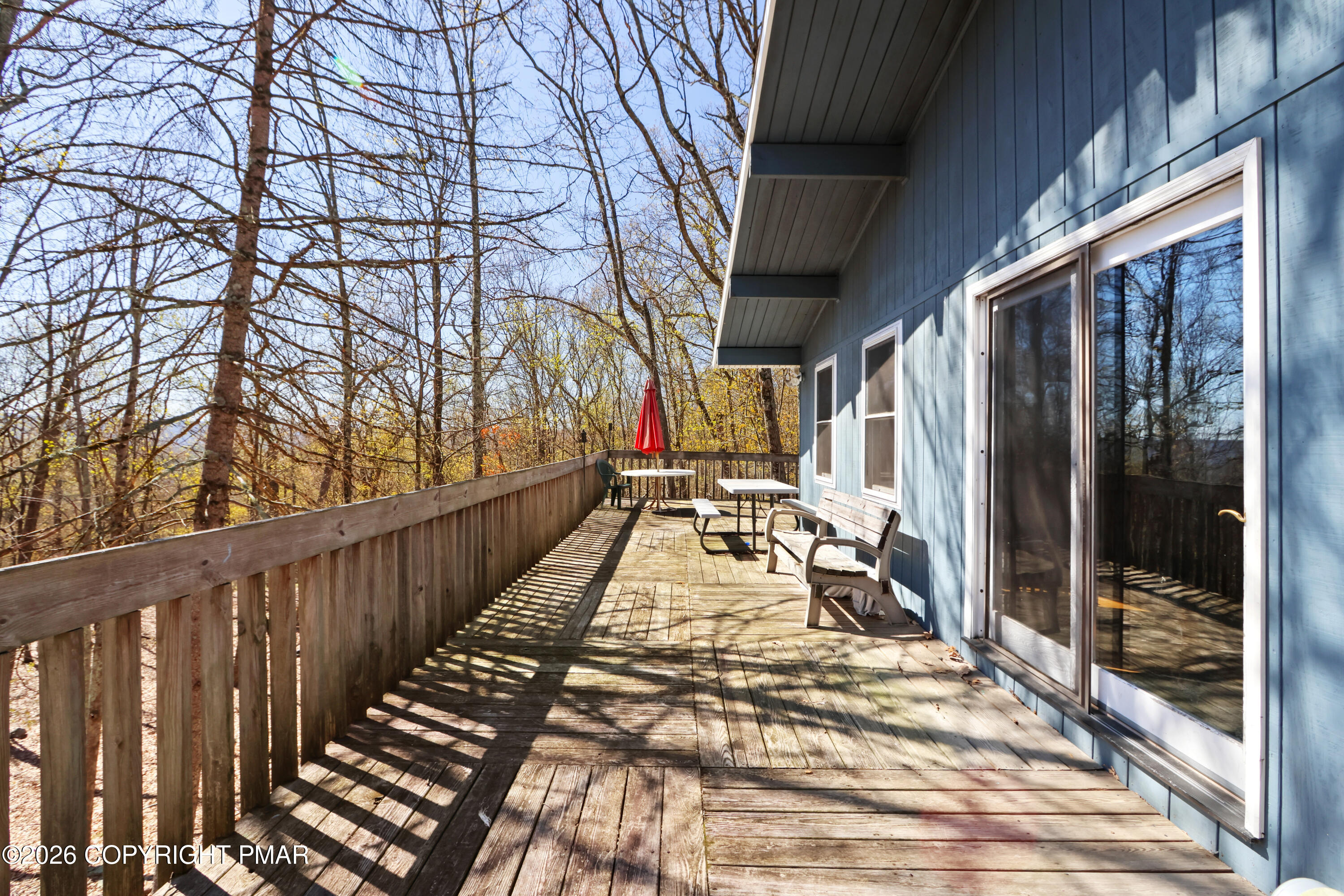 214 Mockingbird Trail Bushkill, PA 18324 - Photo 3 of 41 a view of balcony with wooden floor and fence