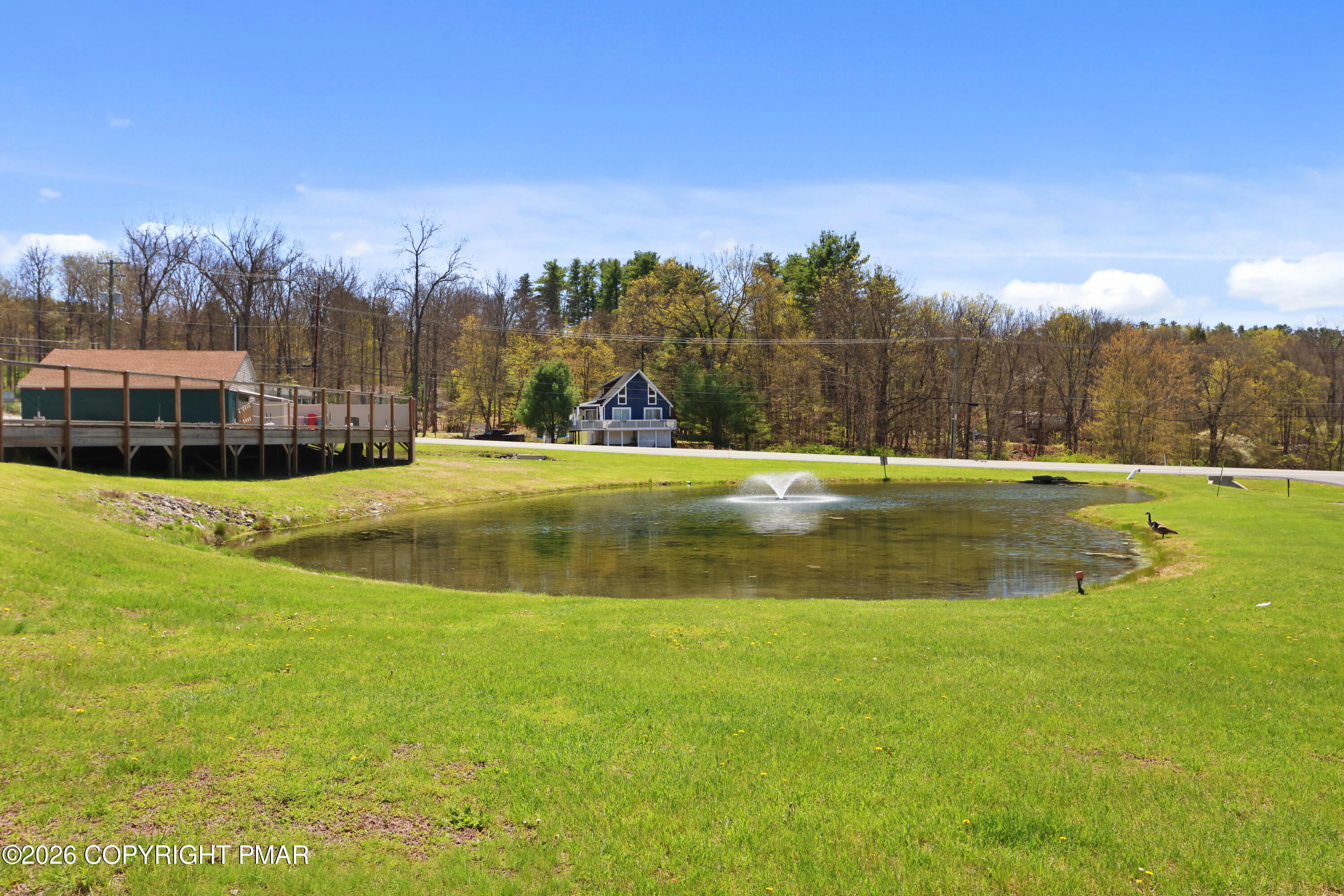 214 Mockingbird Trail Bushkill, PA 18324 - Photo 31 of 41 a view of a swimming pool with a yard