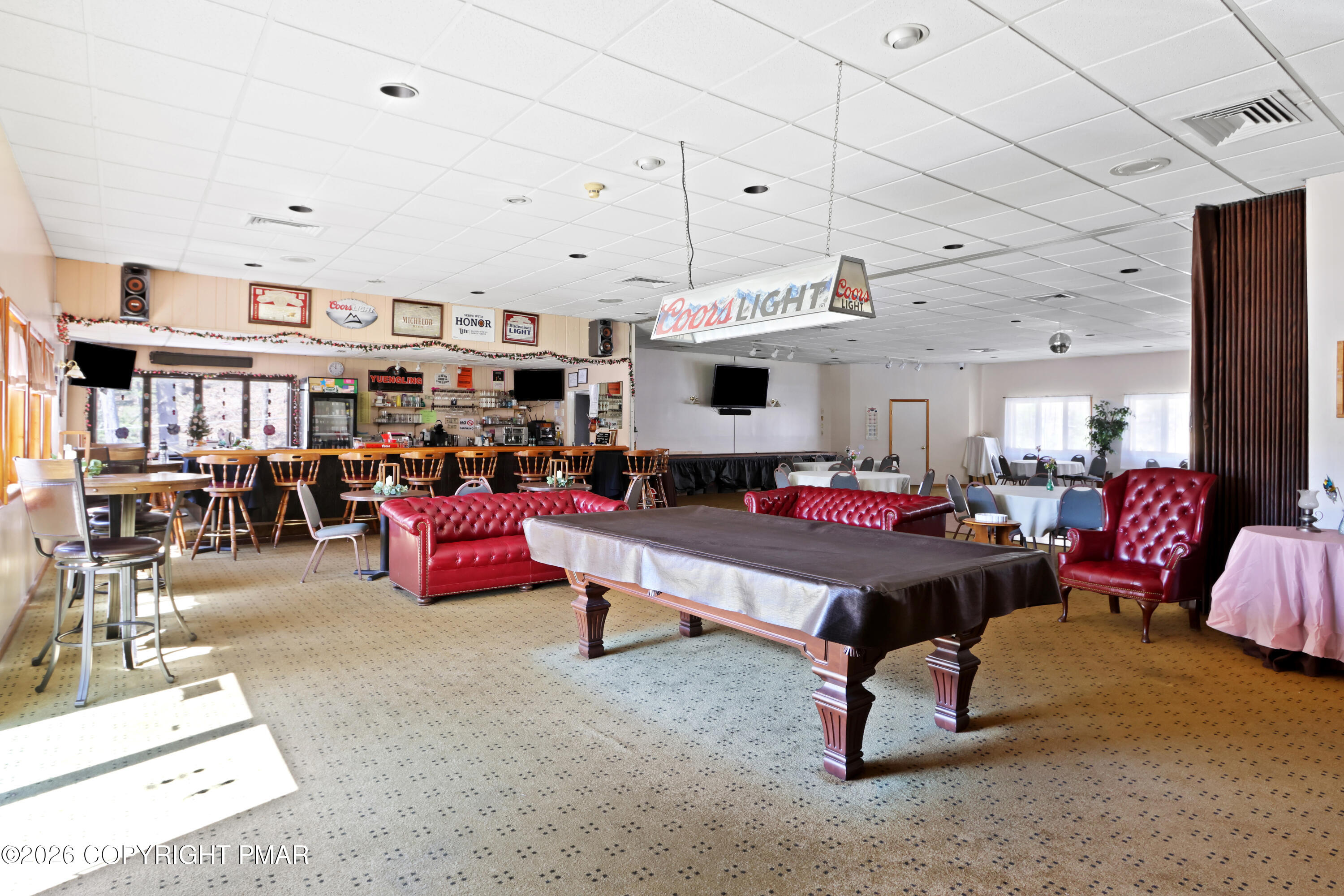 214 Mockingbird Trail Bushkill, PA 18324 - Photo 36 of 41 a living room with furniture gym equipment and a rug