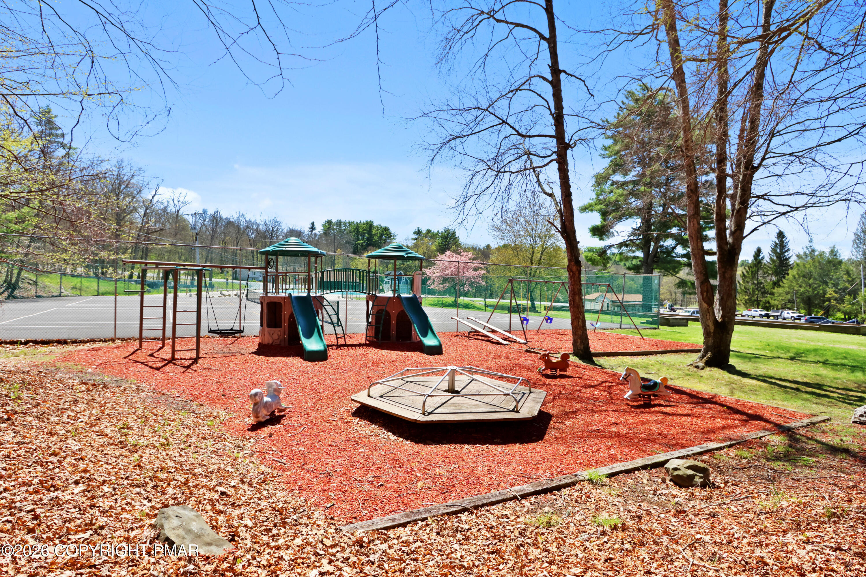 214 Mockingbird Trail Bushkill, PA 18324 - Photo 41 of 41 a view of a patio with a table chairs and a fire pit